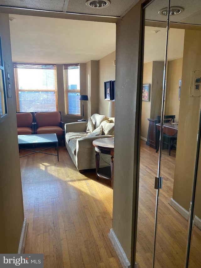 hallway with light hardwood / wood-style flooring