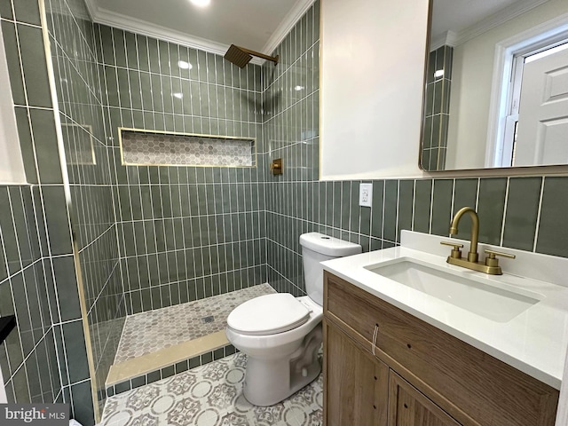 bathroom with tile walls, crown molding, toilet, and tiled shower