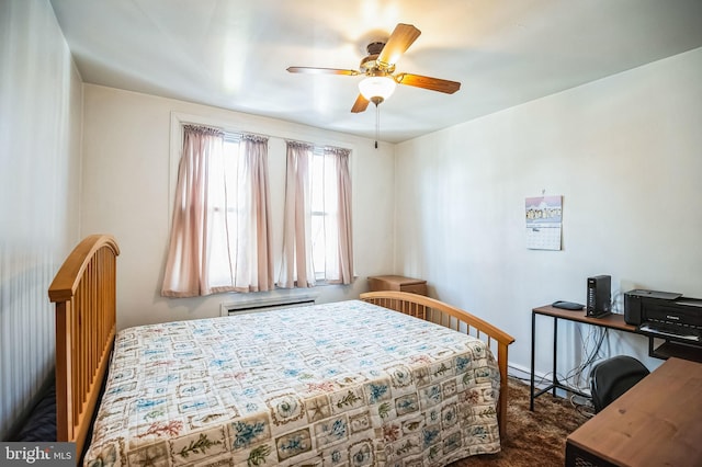 bedroom featuring an AC wall unit, ceiling fan, and dark colored carpet