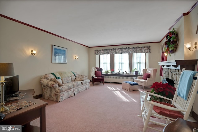 living room with crown molding, carpet floors, a fireplace, and radiator