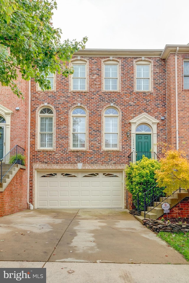 multi unit property featuring a garage