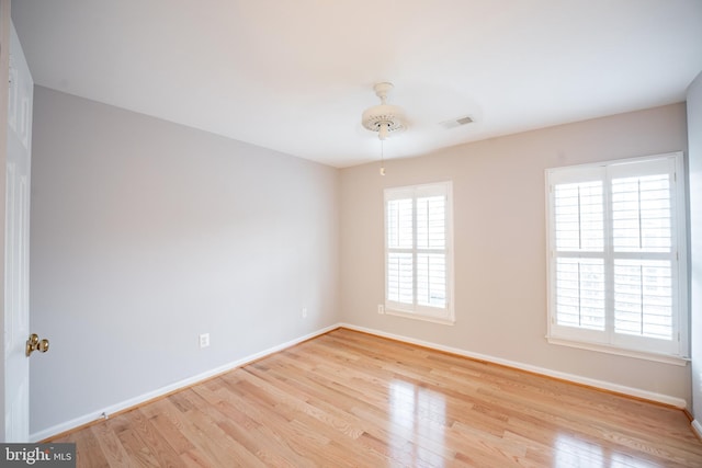 spare room with a healthy amount of sunlight and light wood-type flooring