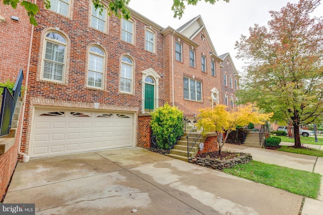 townhome / multi-family property with a garage