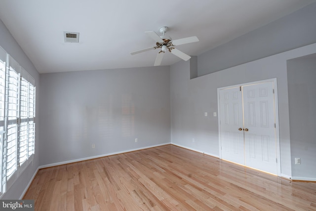 empty room featuring ceiling fan and light wood-type flooring