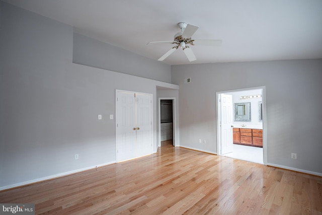 interior space with lofted ceiling, light hardwood / wood-style flooring, and ceiling fan