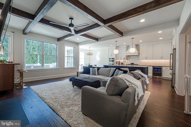 living room with beverage cooler, baseboards, dark wood-style flooring, and beamed ceiling