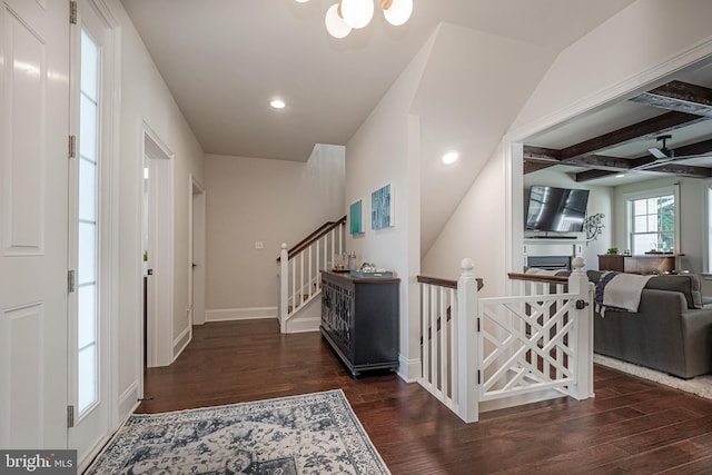 foyer with recessed lighting, wood finished floors, baseboards, stairway, and beamed ceiling