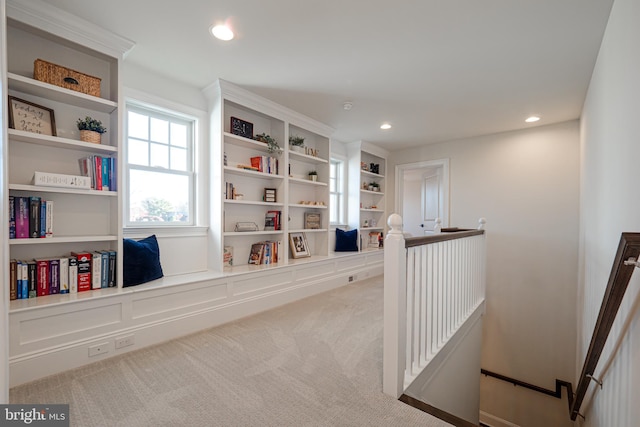 interior space featuring built in features, recessed lighting, and carpet flooring