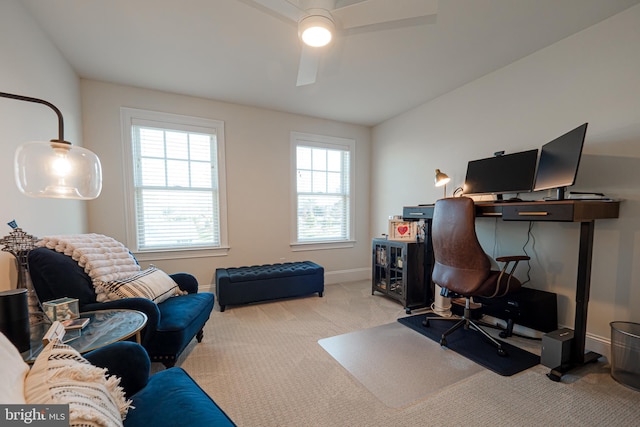 office area featuring carpet floors, baseboards, and a ceiling fan