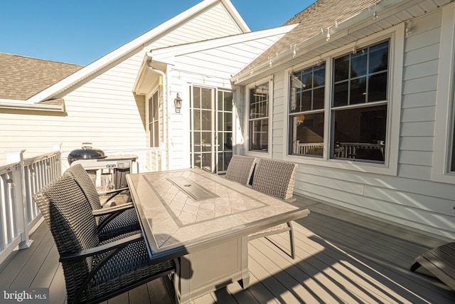 deck with outdoor dining space