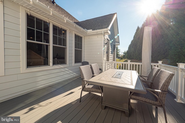 deck featuring outdoor dining area