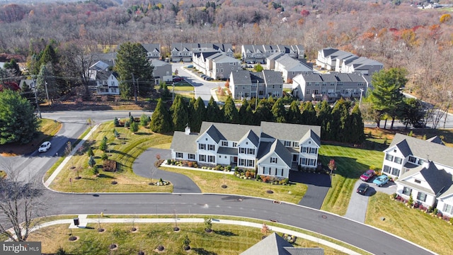 birds eye view of property with a residential view