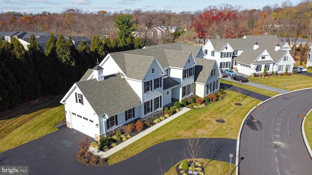 birds eye view of property with a residential view