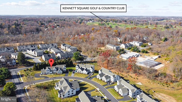 birds eye view of property with a residential view and a view of trees