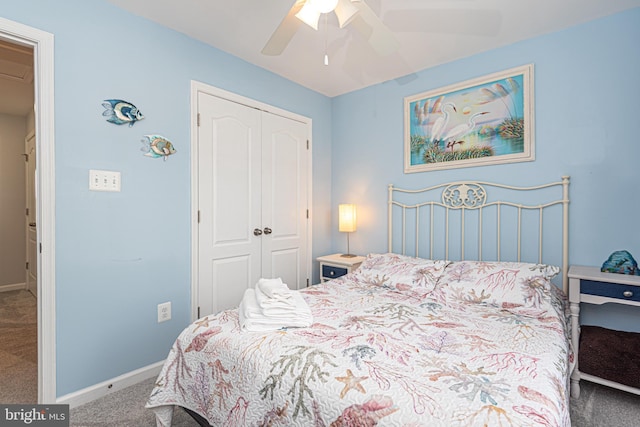 carpeted bedroom with a closet and ceiling fan