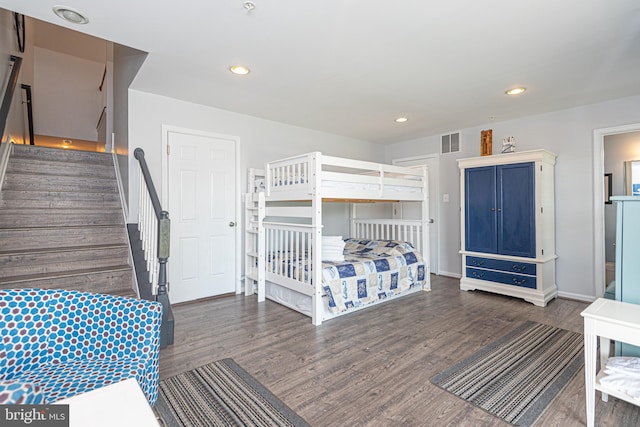 bedroom featuring dark hardwood / wood-style floors