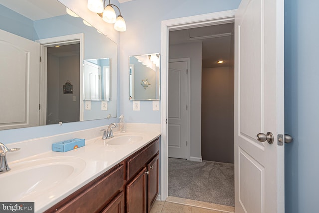 bathroom with tile patterned floors and vanity