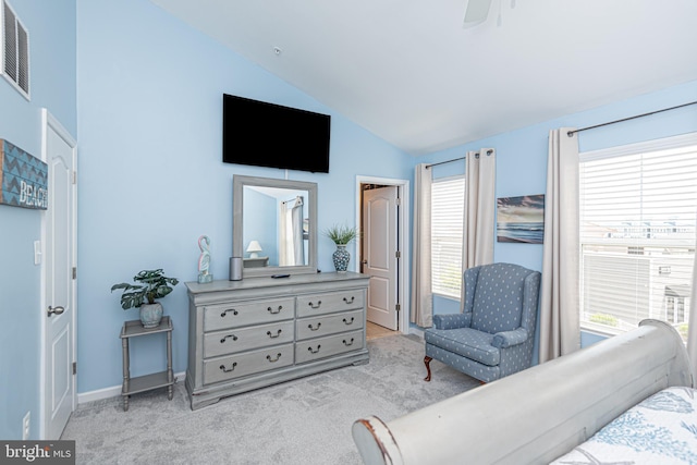 carpeted bedroom featuring ceiling fan and vaulted ceiling