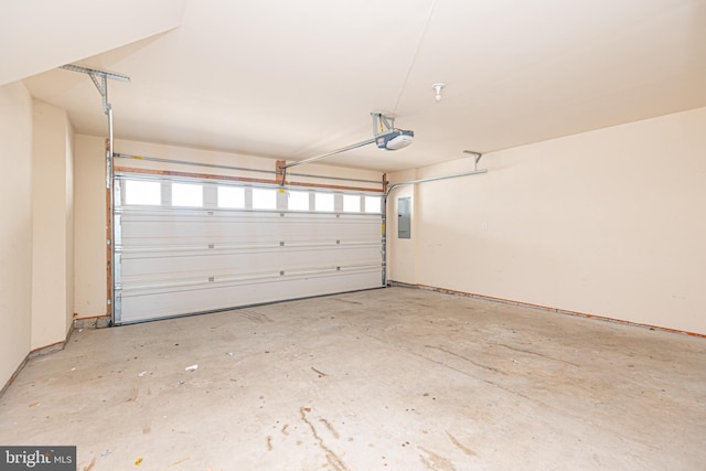 garage with electric panel and a garage door opener