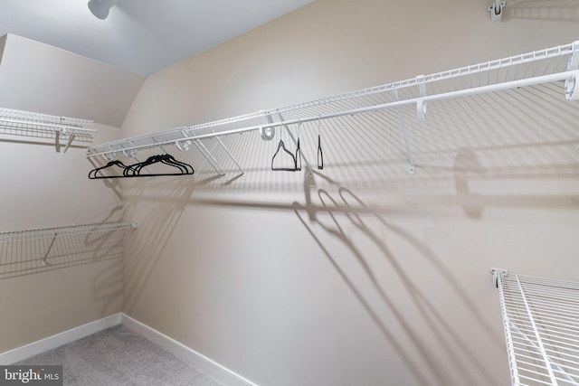 spacious closet featuring carpet and lofted ceiling