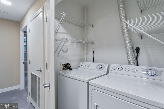 laundry area with separate washer and dryer