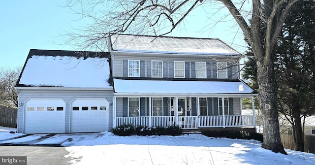 view of front of home with a garage and a porch