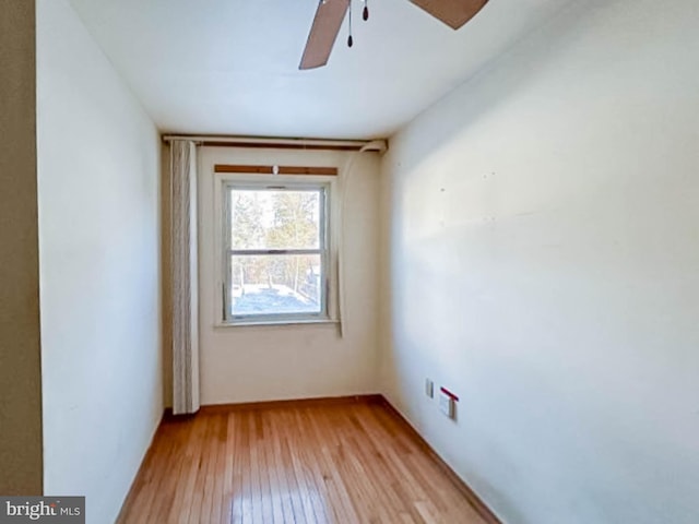 unfurnished room featuring light wood-type flooring and ceiling fan