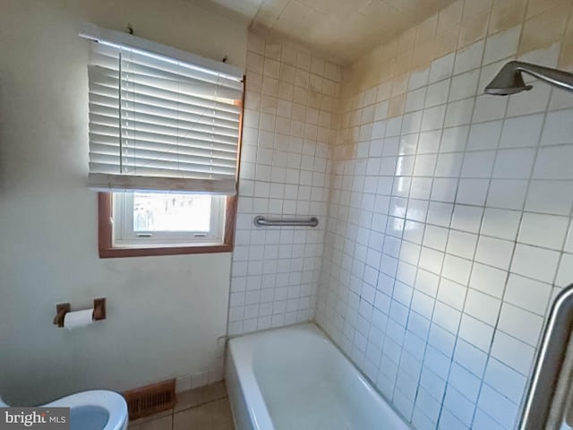 bathroom featuring tile patterned flooring and toilet