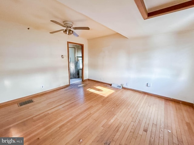 empty room featuring light wood-type flooring and ceiling fan