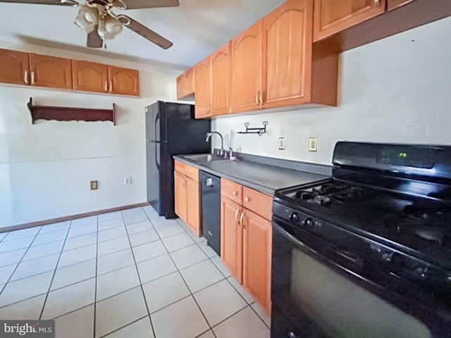 kitchen featuring light tile patterned floors, ceiling fan, black appliances, and sink