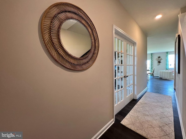 hall with french doors and dark hardwood / wood-style flooring