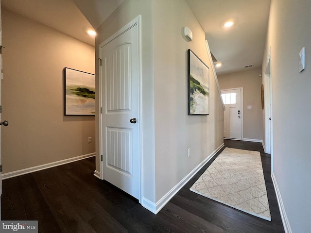 hallway featuring dark hardwood / wood-style floors