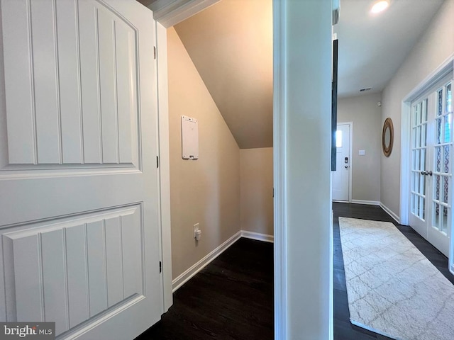 corridor with french doors and dark hardwood / wood-style floors