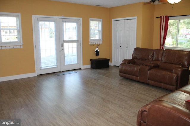 living room with hardwood / wood-style floors and ceiling fan