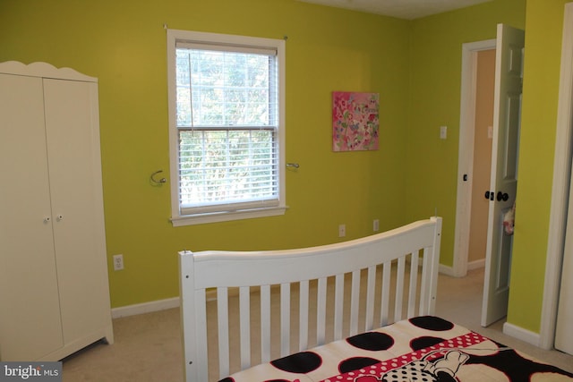 carpeted bedroom with a closet