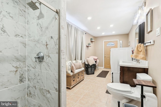 bathroom featuring recessed lighting, toilet, a stall shower, vanity, and tile patterned flooring