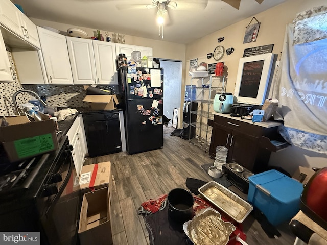 kitchen with white cabinetry, ceiling fan, decorative backsplash, dark wood-type flooring, and black appliances