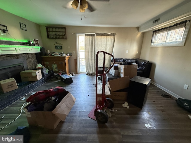 miscellaneous room featuring ceiling fan and dark wood-type flooring