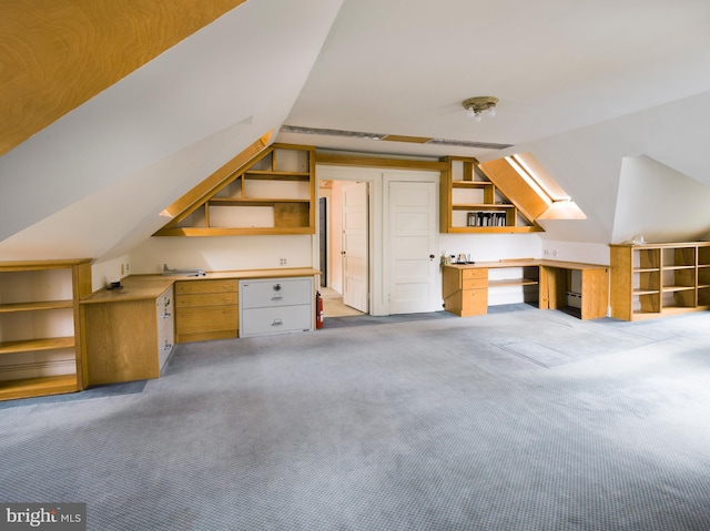 additional living space featuring light colored carpet and lofted ceiling