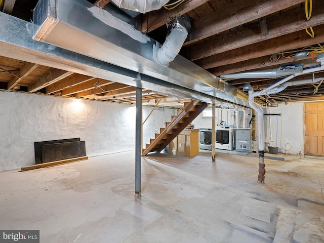 basement with washer and clothes dryer