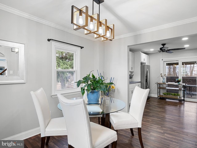 dining room with ceiling fan with notable chandelier, dark hardwood / wood-style floors, and ornamental molding