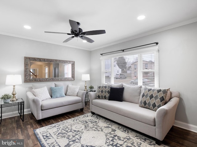 living room featuring ceiling fan, dark hardwood / wood-style floors, and ornamental molding