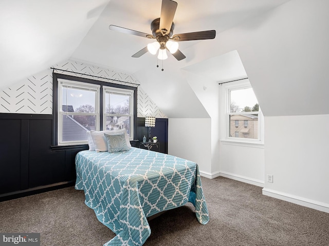 bedroom with ceiling fan, lofted ceiling, and carpet floors