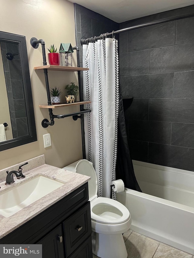 full bathroom featuring toilet, tile patterned floors, vanity, and shower / tub combo