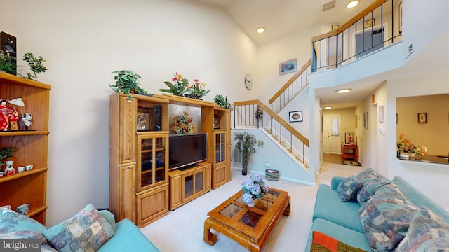 living room featuring light carpet and high vaulted ceiling