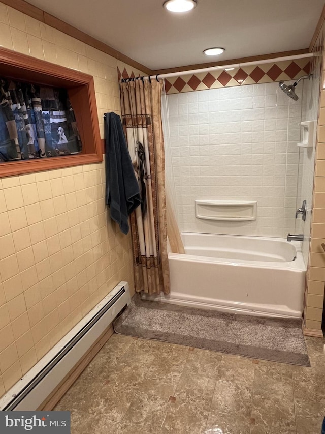 bathroom with tile walls, shower / bath combo, a baseboard heating unit, and ornamental molding