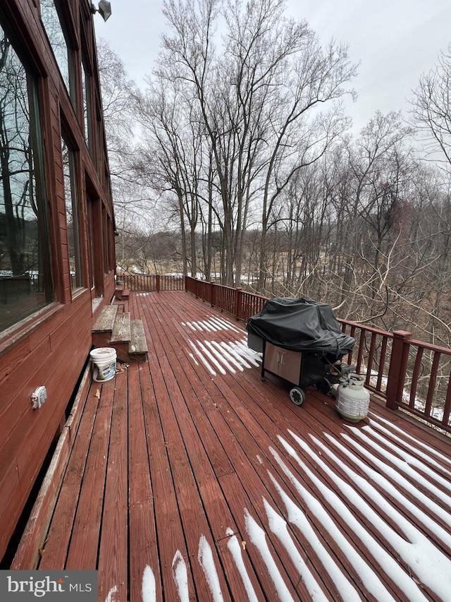 wooden deck featuring area for grilling