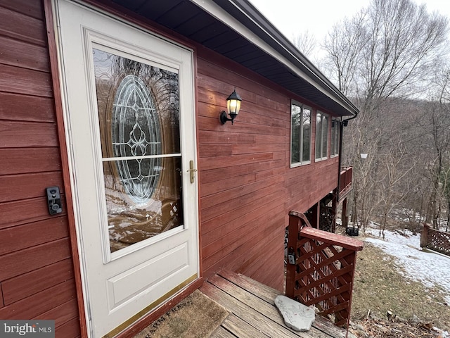 view of snow covered property entrance