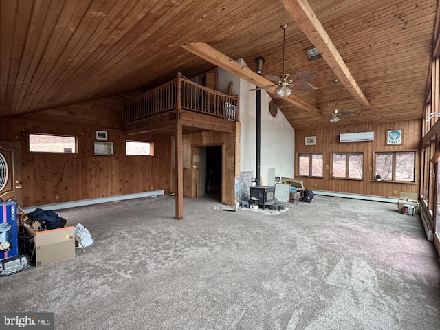 interior space featuring beam ceiling, wood ceiling, high vaulted ceiling, and a wood stove