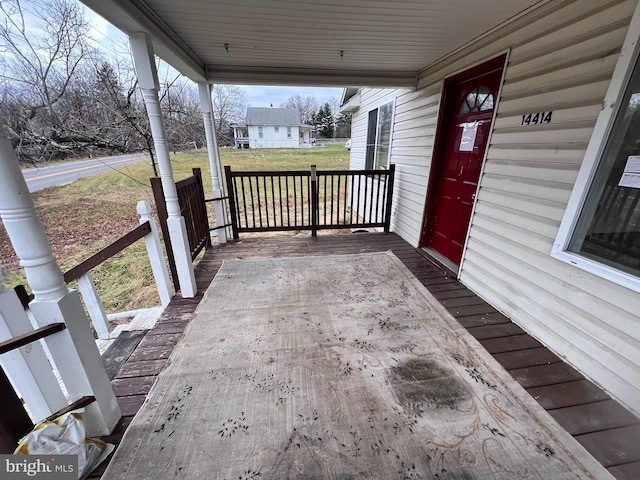 wooden terrace featuring a porch